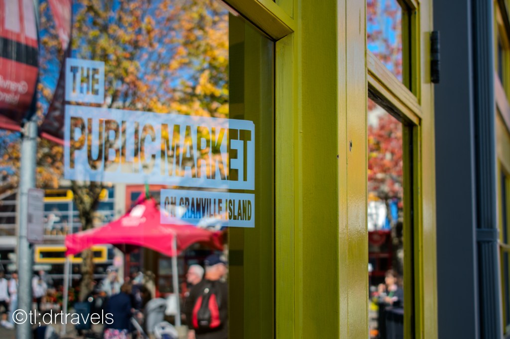 The glass door of Granville Island's Public Market