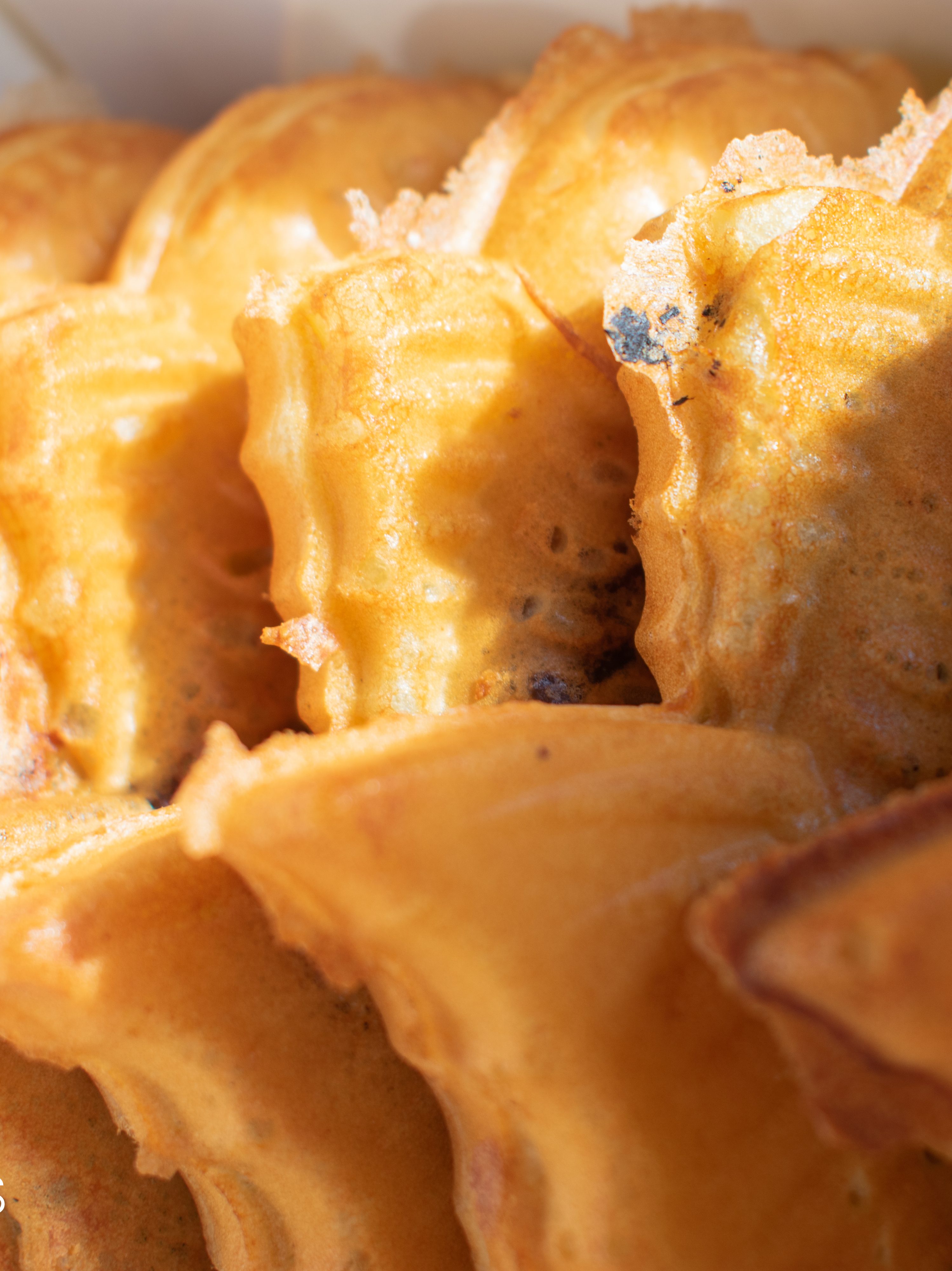 Freshly baked bungeoppang, a street food pastry desert, are laid in a row.
