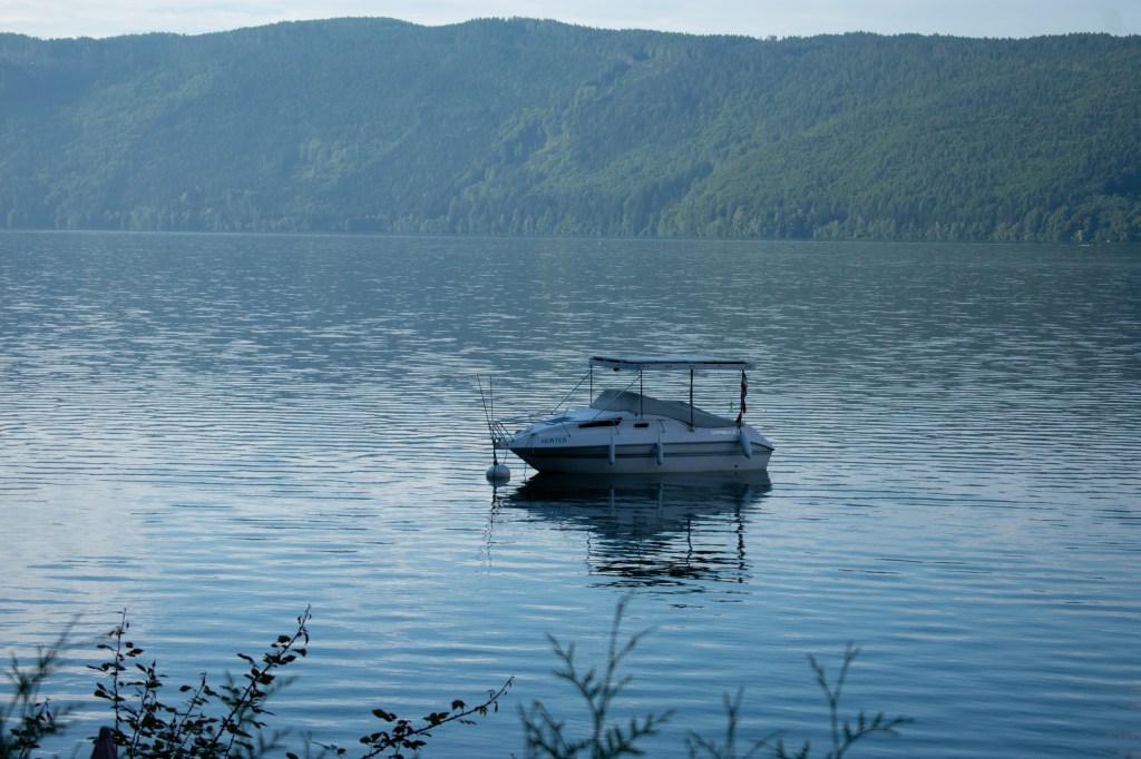 A boat sits on the lake, a popular activity for tourists